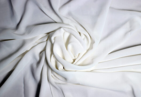 SRB Georgette fabric with a lightweight, sheer texture and a soft, flowing drape, ideal for elegant outfits and stylish designs