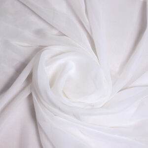 "Elegant georgette fabric draped gracefully, showcasing its lightweight, sheer texture with soft folds and a delicate flow."
